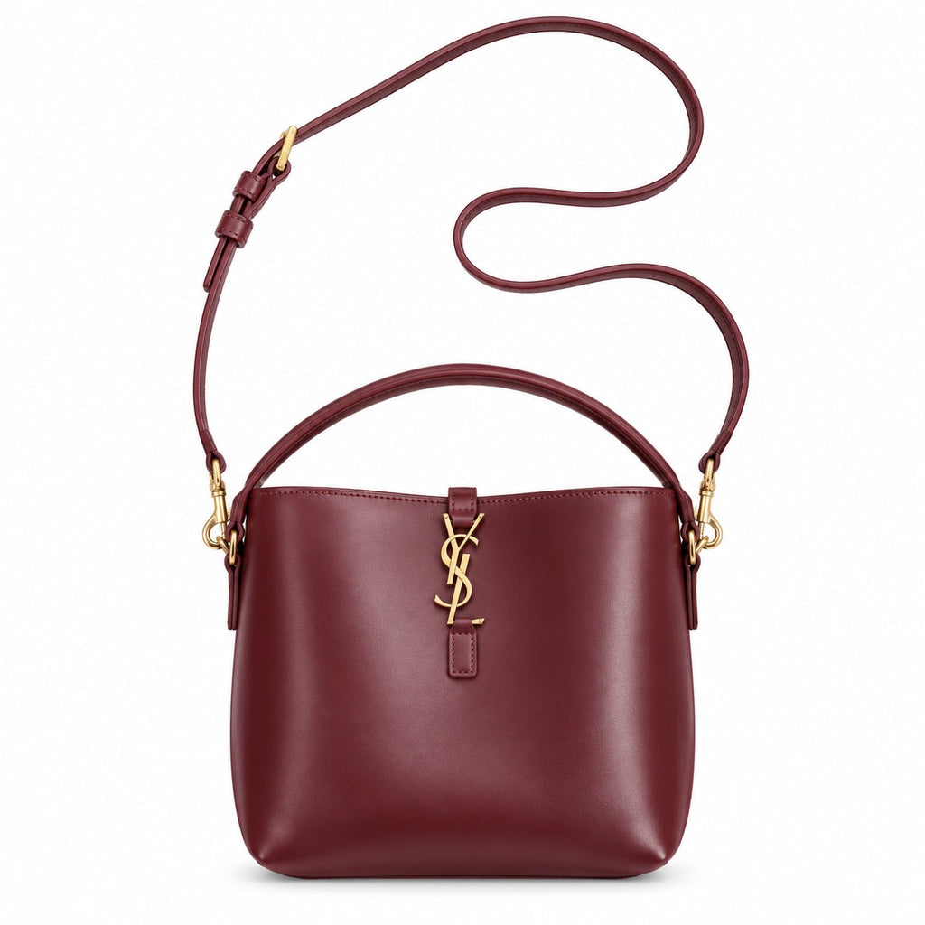 YSL Le 37 Bucket Bag in burgundy smooth leather with gold YSL cassandre monogram charm, top loop handle and long adjustable crossbody strap, front view